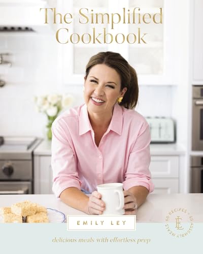 Cookbook cover featuring a smiling woman in a kitchen setting.