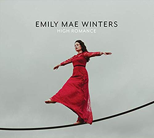 Album cover featuring a woman in a red dress balancing on a tightrope.