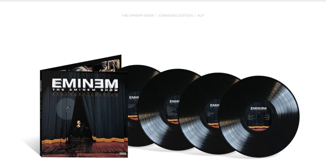 Four black vinyl LPs and a cover featuring Eminem in front of curtains.