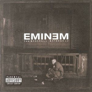 Eminem's "The Marshall Mathers LP" CD cover: a man sits by a building.