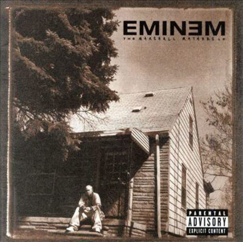 Sepia-toned album cover featuring Eminem sitting in front of a weathered house.