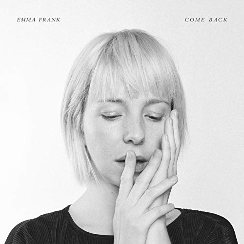 Black and white album cover featuring a woman with short hair touching her face.