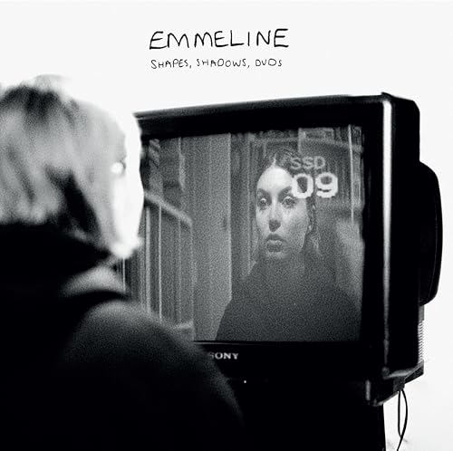 Black and white album cover featuring a person watching a TV screen.