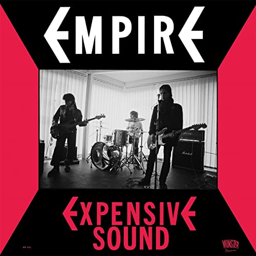 Vinyl record cover: band performing in a room, red and black design.