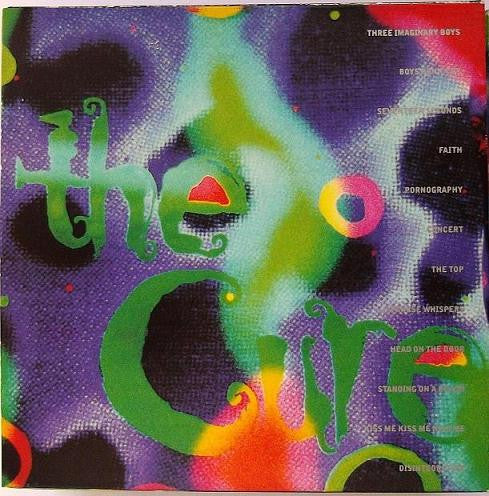CD cover for “Empty Days” by The Cure, abstract green and purple design.