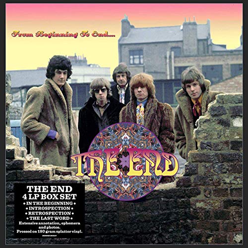 1970s album cover featuring five men in front of a stone wall.