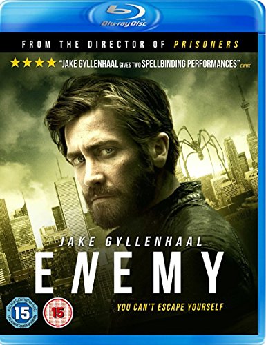 Blu-ray cover for the film Enemy featuring Jake Gyllenhaal and a giant spider silhouette.