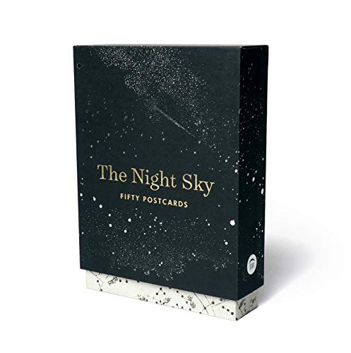 Black box of "The Night Sky" postcards with gold star details.