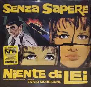 Vinyl cover art featuring a man in a hat, a car, and woman's face.