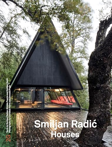Black A-frame house with large glass windows, book cover featuring the building.
