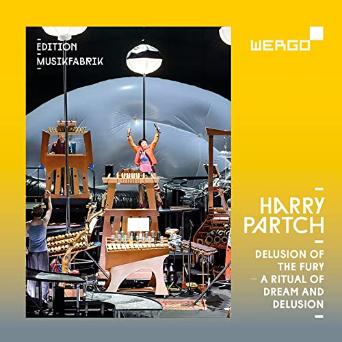 CD cover: musicians performing with unique instruments on a stage.