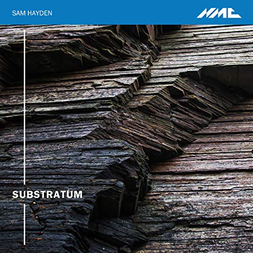 "CD cover with a dark, layered rock formation and blue header."