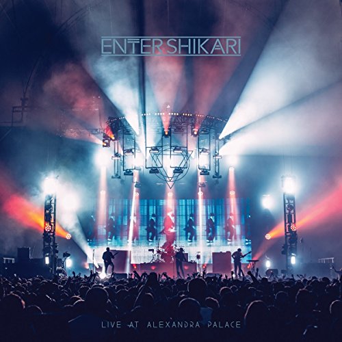 Enter Shikari live concert stage with band silhouetted against bright lights.