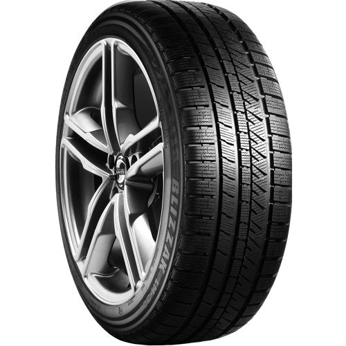Black car tire with silver rim and "BLIZZAK LM-60" lettering.