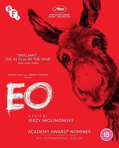 Red movie poster featuring a close-up of a donkey’s face, title “EO”.