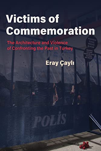Book cover with blurred figures behind a barred window and red flowers.