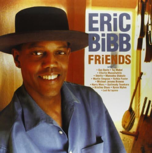 Eric Bibb album cover featuring a smiling man in a hat.