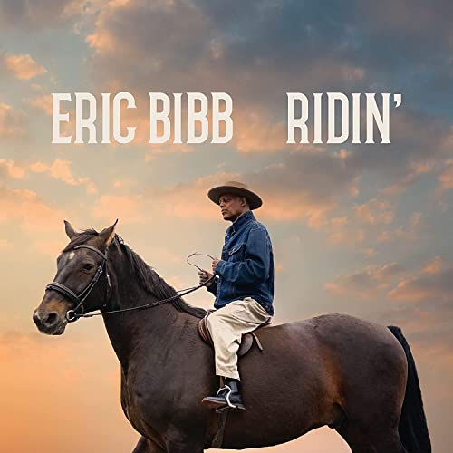 Eric Bibb album cover: man on horseback against a sunset sky.