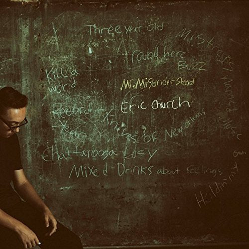 Eric Church's "Mr. Misunderstood" CD cover featuring a man by a chalkboard.