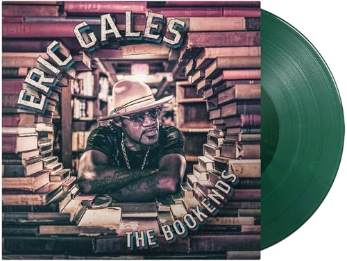 Eric Gales album cover with a man framed by stacked books and a green vinyl record.