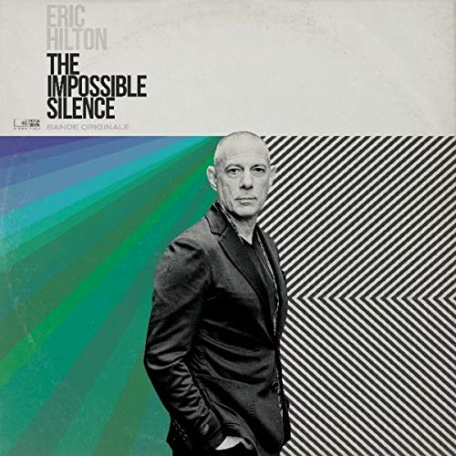 Vinyl album cover featuring a portrait of Eric Hilton with abstract design.
