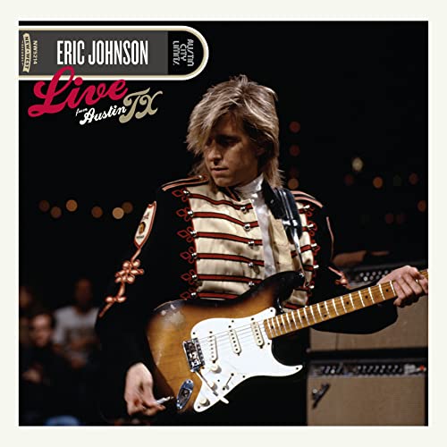 Eric Johnson playing a guitar on the album cover "Live From Austin, TX".