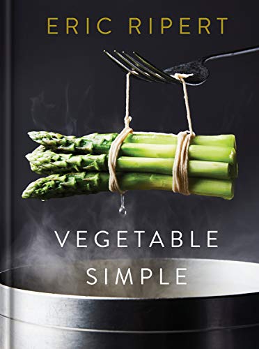 Cookbook cover featuring asparagus suspended by twine over a pot.