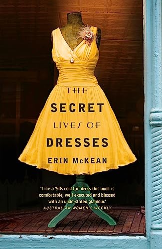 Yellow dress on a mannequin, book cover titled “The Secret Lives of Dresses.”