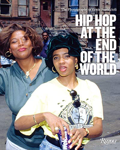 Two women, one in a green hoodie and one in a yellow shirt, pose outdoors.