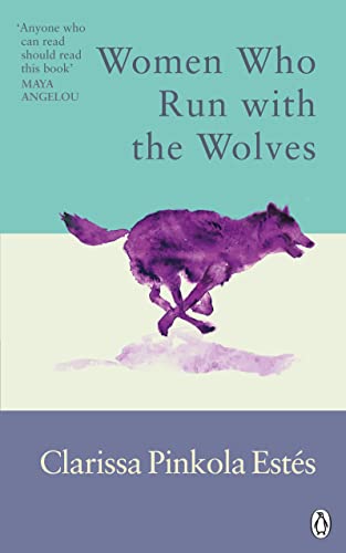 Book cover: purple wolf running, title “Women Who Run With the Wolves”.