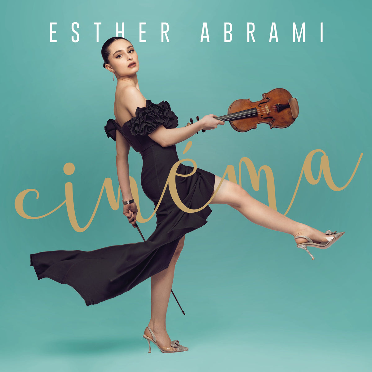 Violinist Esther Abrami in a black dress, posing with her instrument.
