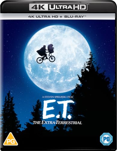 E.T. and a boy fly on a bicycle silhouetted against a full moon.