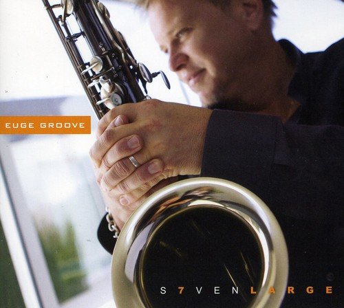 A man holding a saxophone, with text "Euge Groove" and "Seven Large" on the image.