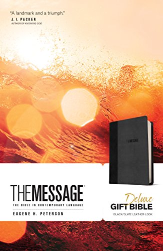 "Black leather-bound Bible with 'The Message' embossed on the cover, on a white background."