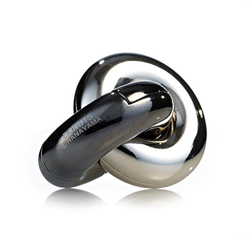 Shiny metal puzzle with interlocking circular and curved shapes.