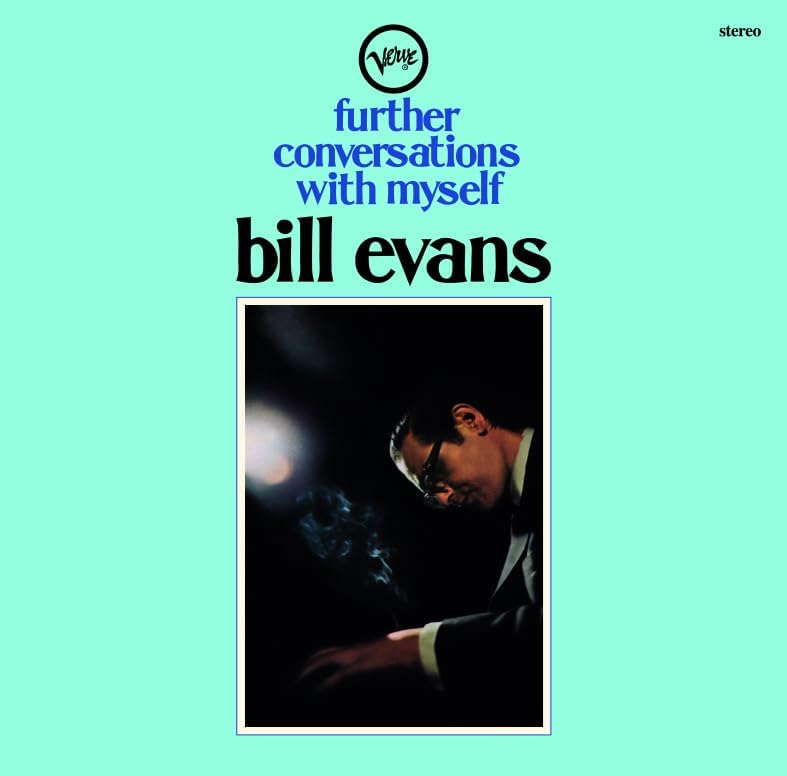 Album cover with light blue background, text, and a photo of Bill Evans playing piano.