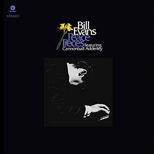 Vinyl cover featuring Bill Evans playing piano, yellow flowers, and text on black background.