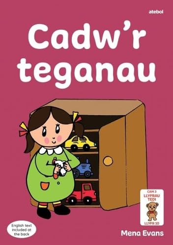 A girl in a green dress stands next to a toy cupboard on a book cover.