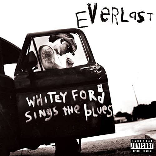 Black and white album cover featuring a man in a car window.