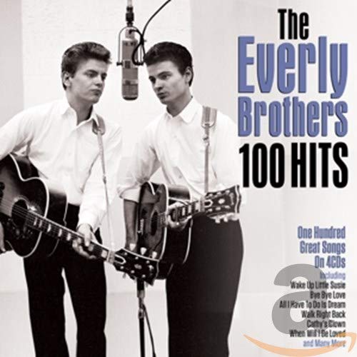 Black and white photo of the Everly Brothers playing acoustic guitars in a studio.
