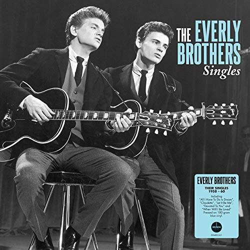 Black and white album cover of The Everly Brothers playing guitars.