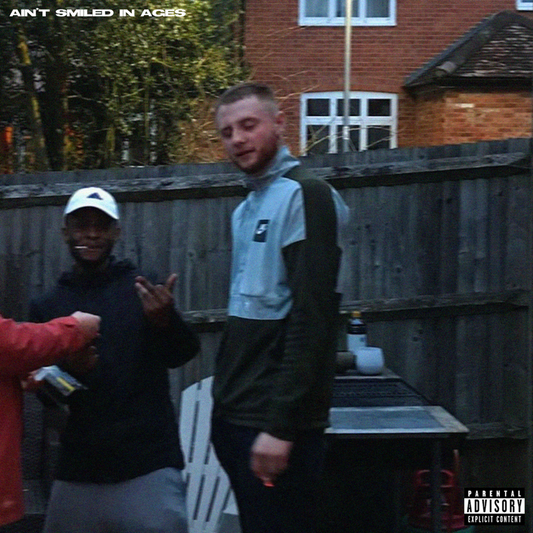 Album cover featuring two people standing in front of a brick building.