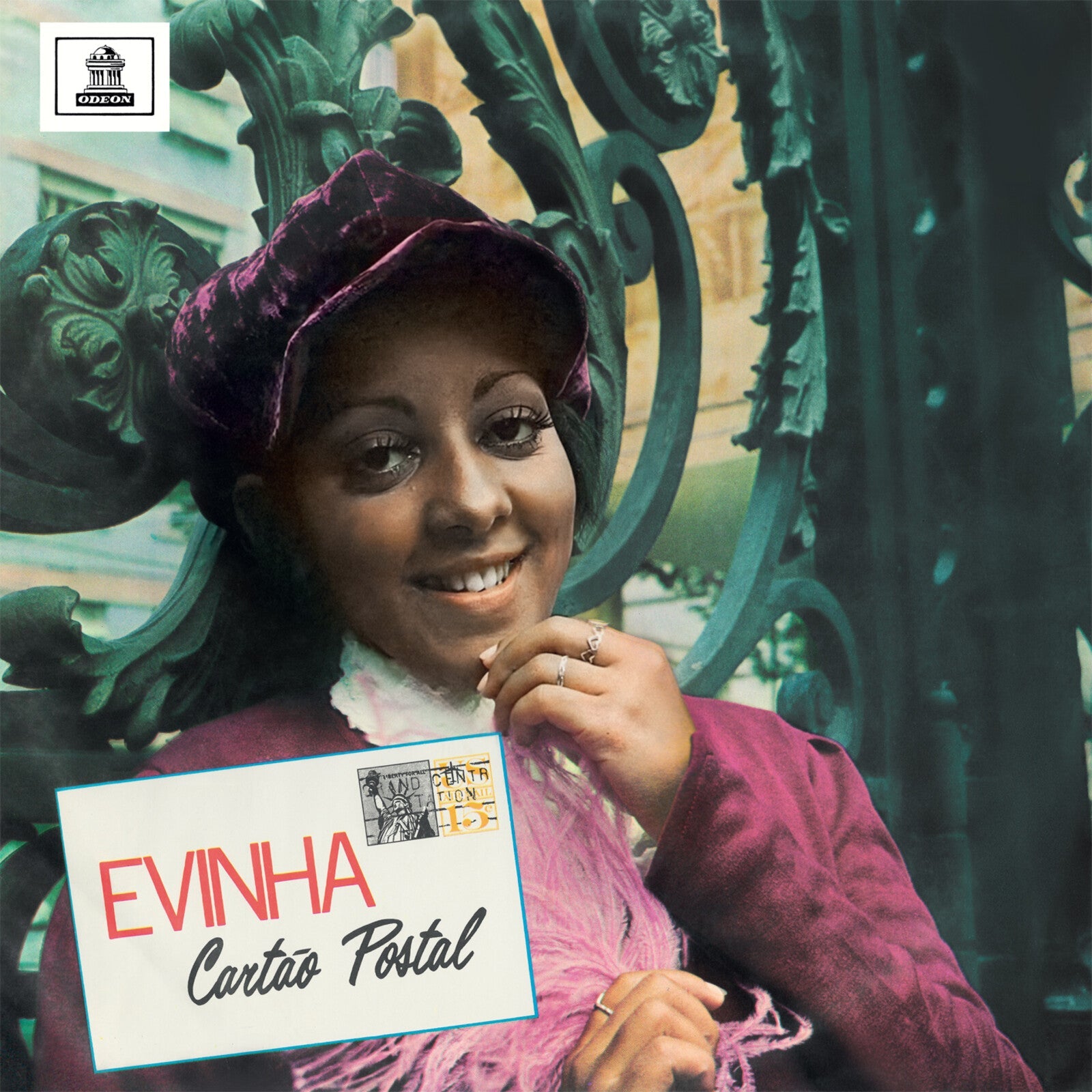Vintage vinyl album cover featuring Evinha, a smiling woman with a postcard.