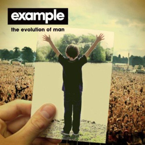 CD cover: man with arms raised over a crowd, held by a hand.