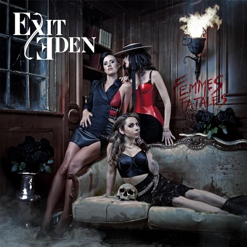 Three women in gothic attire pose in a dimly lit room with a skull.