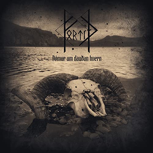 Album cover: ram skull on rocky shore with mountainous, misty background.