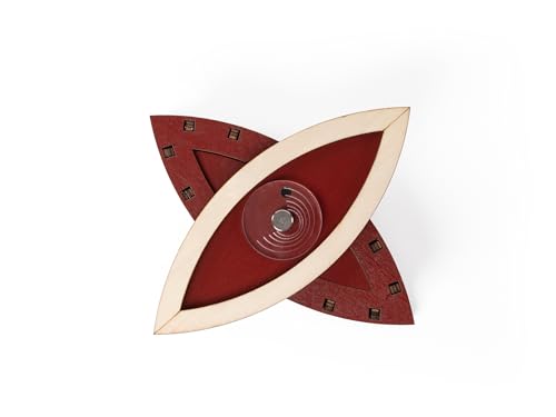 Wooden puzzle shaped like the Eye of Horus, with red and beige tones.