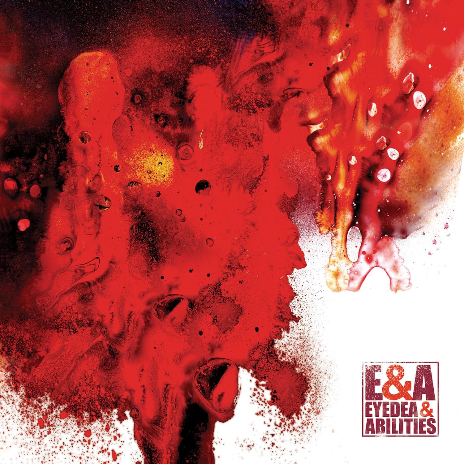 Abstract red and black ink splatter art with E&A Eyedea & Abilities text logo.