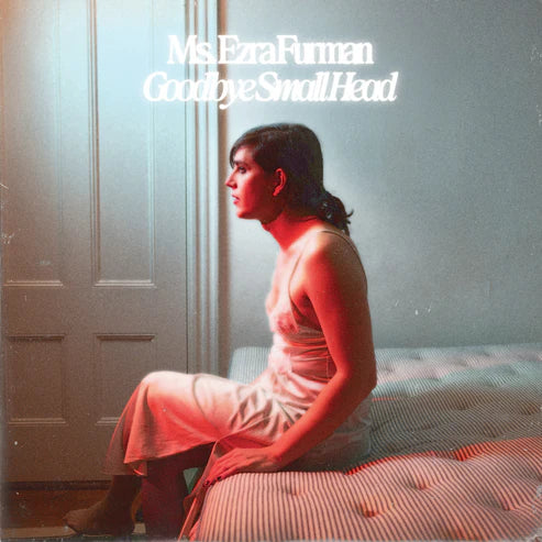 CD cover: woman in profile, seated in red-toned light.