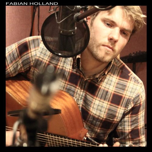 Fabian Holland, a man with a guitar, in a recording studio.